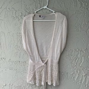 Jennifer Lopez front tie sweater.